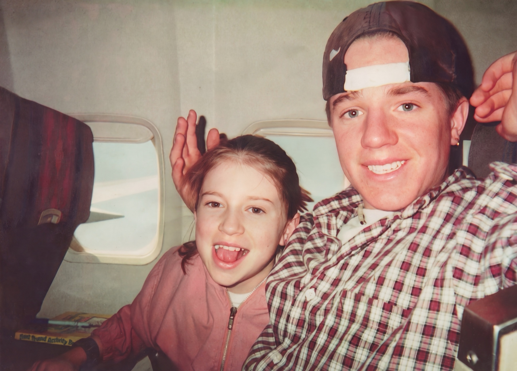 Brian taking a plane selfie with family